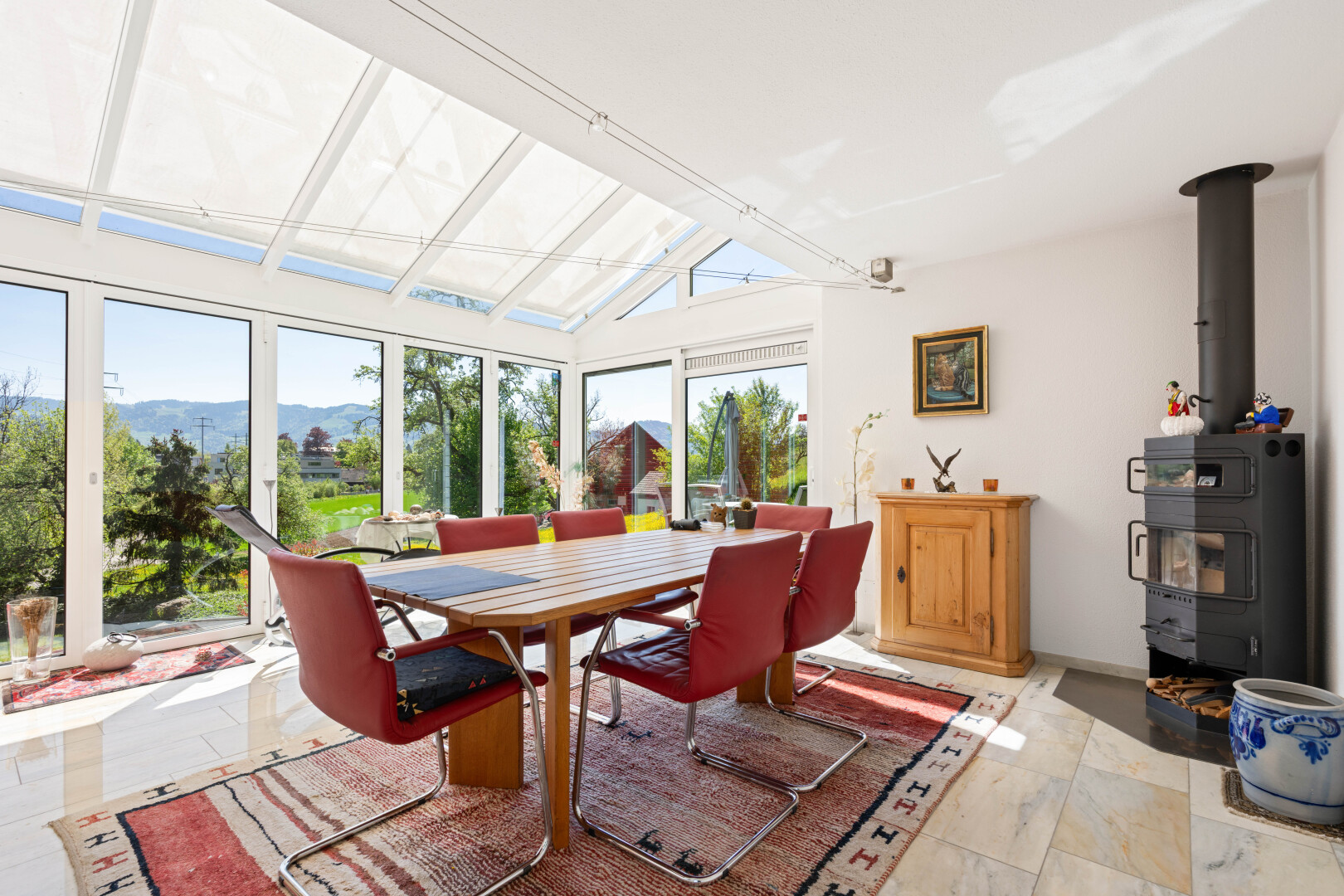 dining area with a mountain view and lofted ceiling