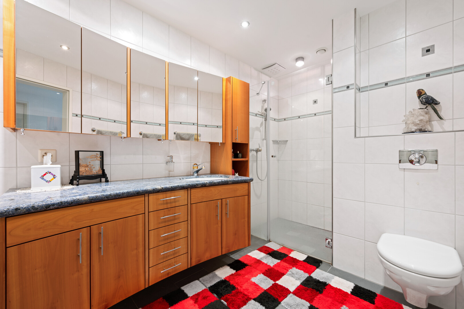 kitchen with tile walls, wood finish cabinetry, and recessed lighting