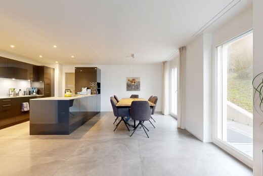 salle à manger avec inside property, cloison sèche, drywall, sol en béton, et concrete floor