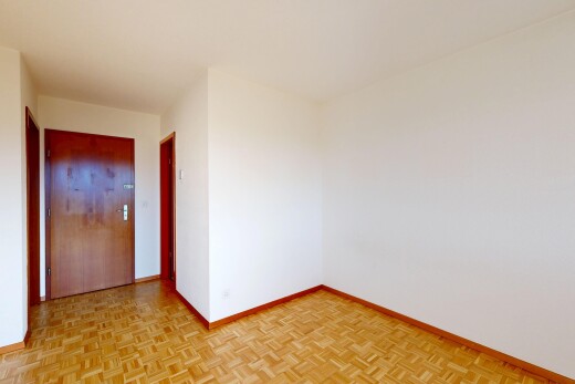 spare room with baseboards and parquet flooring