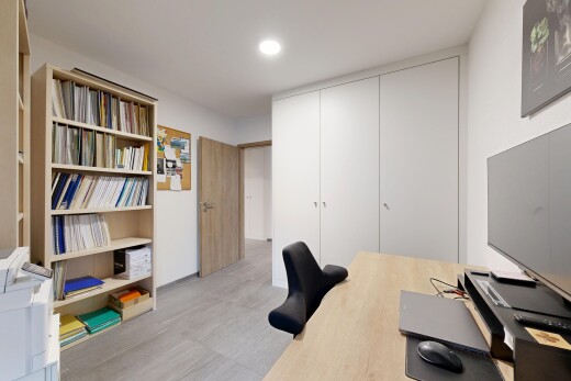 office space with recessed lighting and a closet