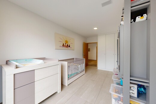 room with recessed lighting, a closet, and a nursery area