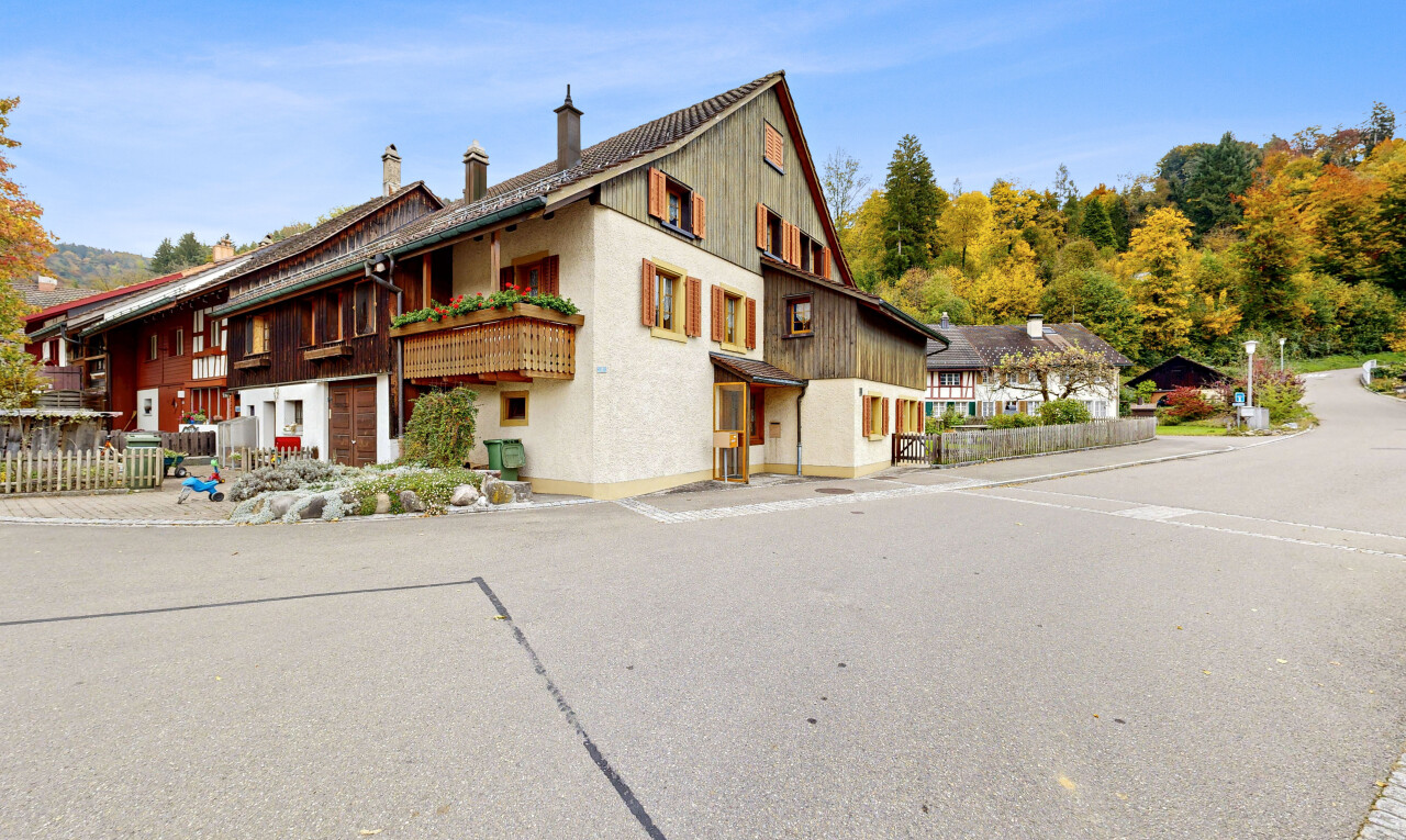 view of home featuring a chimney