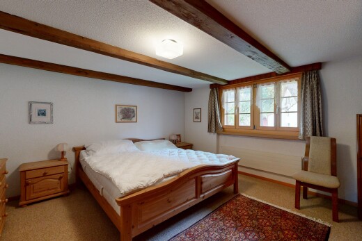 zimmer / schlafzimmer mit inside property, natürliches licht, natural light, balkendecke, und beamed ceiling