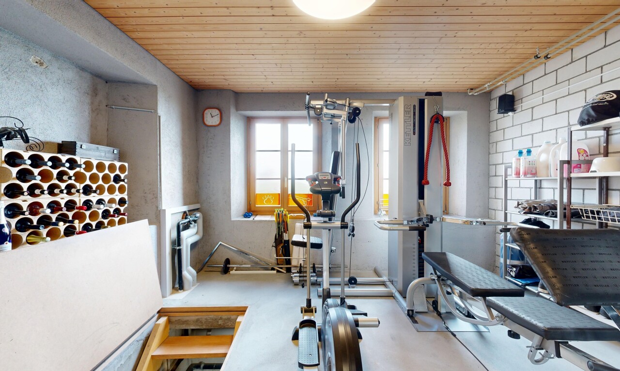 exercise room featuring wooden ceiling