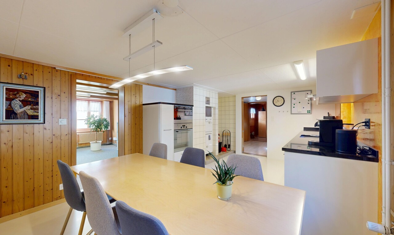 dining space with wooden walls and radiator heating unit