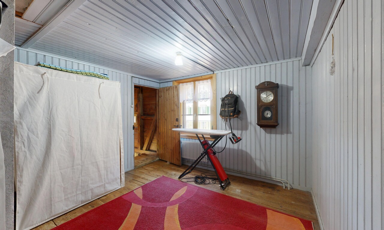 gym featuring wood finished floors and radiator heating unit