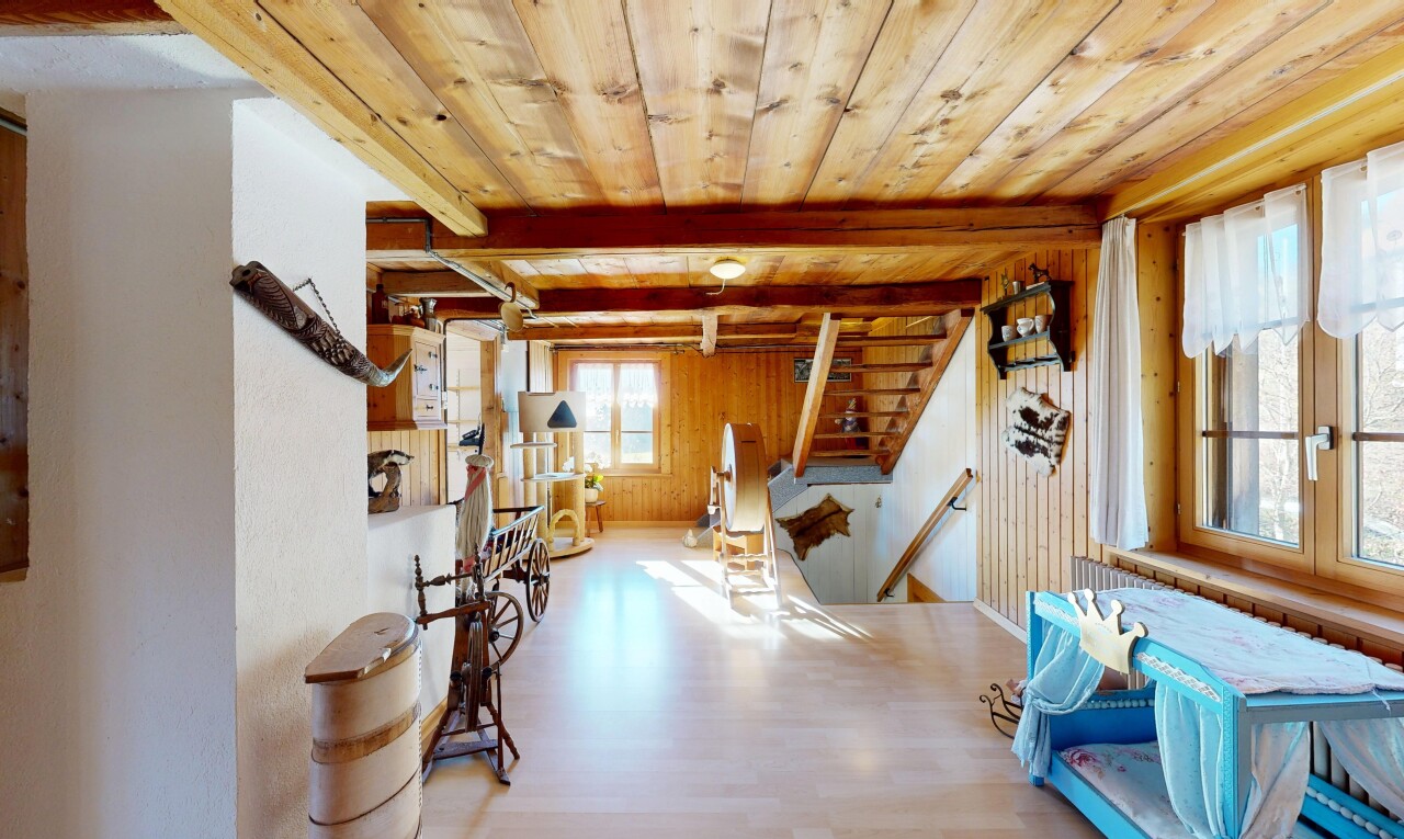 dining room featuring a wood ceiling with exposed beams, wood finished floors, stairway, and wood walls