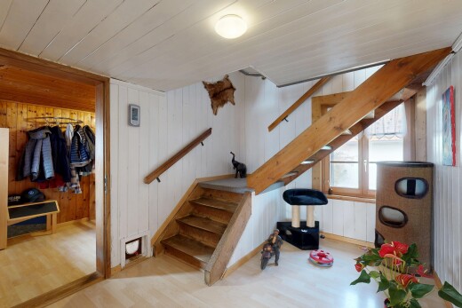 stairway featuring wood walls, wood finished floors, and wood ceiling