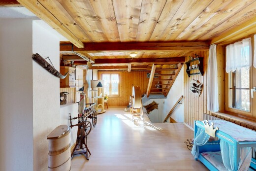 dining room featuring a wood ceiling with exposed beams, wood finished floors, stairway, and wood walls