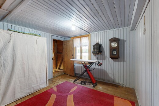 gym featuring wood finished floors and radiator heating unit
