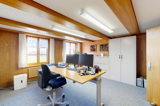 home office with wooden walls, radiator, light colored carpet, and beam ceiling