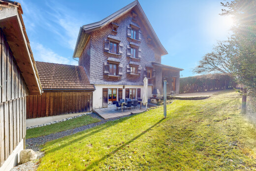 outdoor house featuring a yard and a patio area