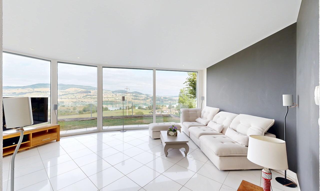 wohnzimmer mit floor ceiling windows, view focus, fernseher, drywall, und gipskartonwand