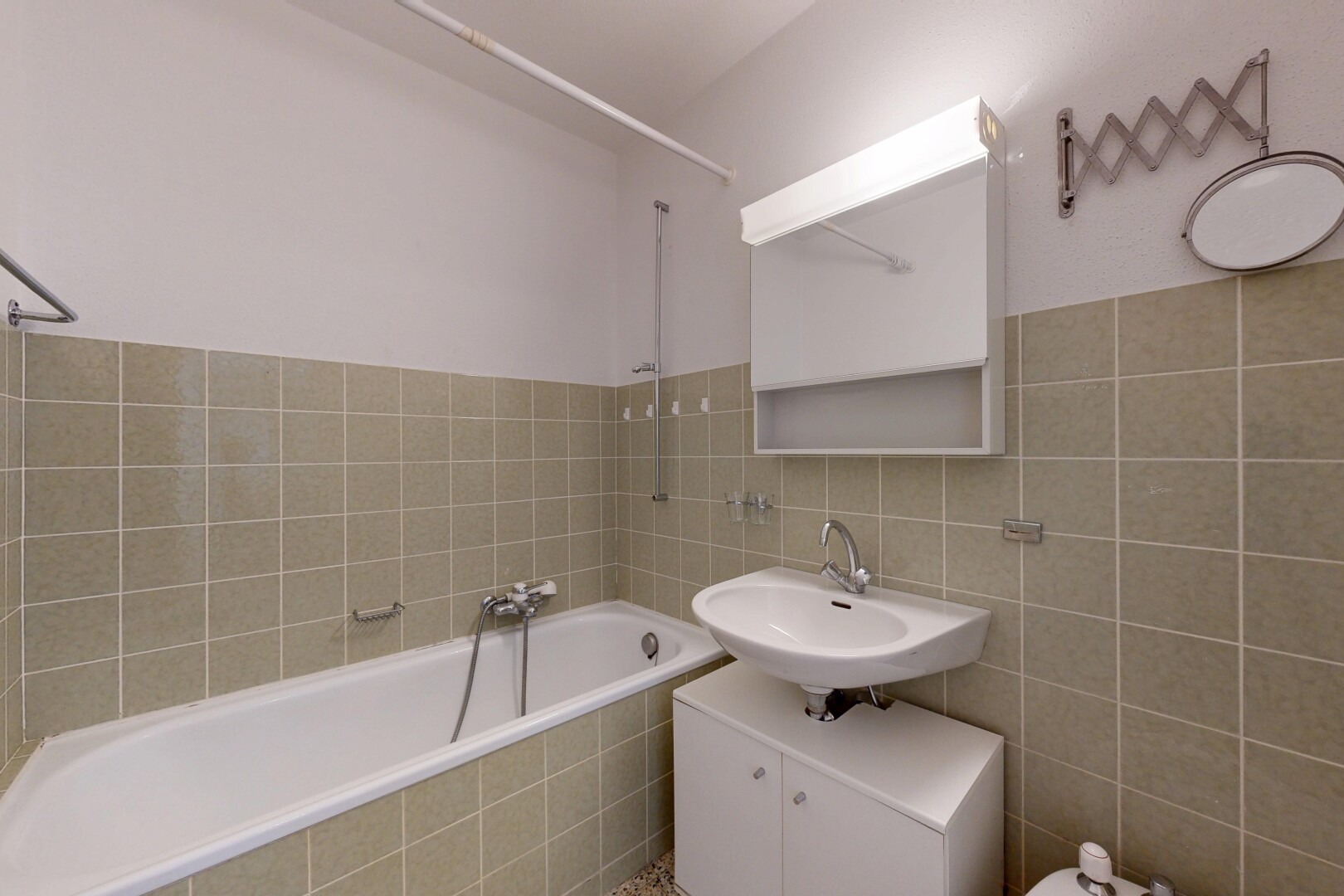 bathroom with tile walls and vanity