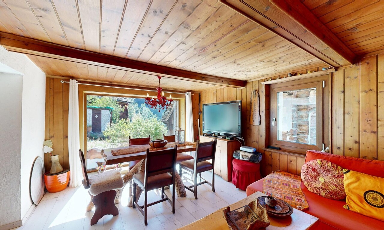 dining area featuring a wooden ceiling with exposed beams, wooden walls, and light wood-style floors
