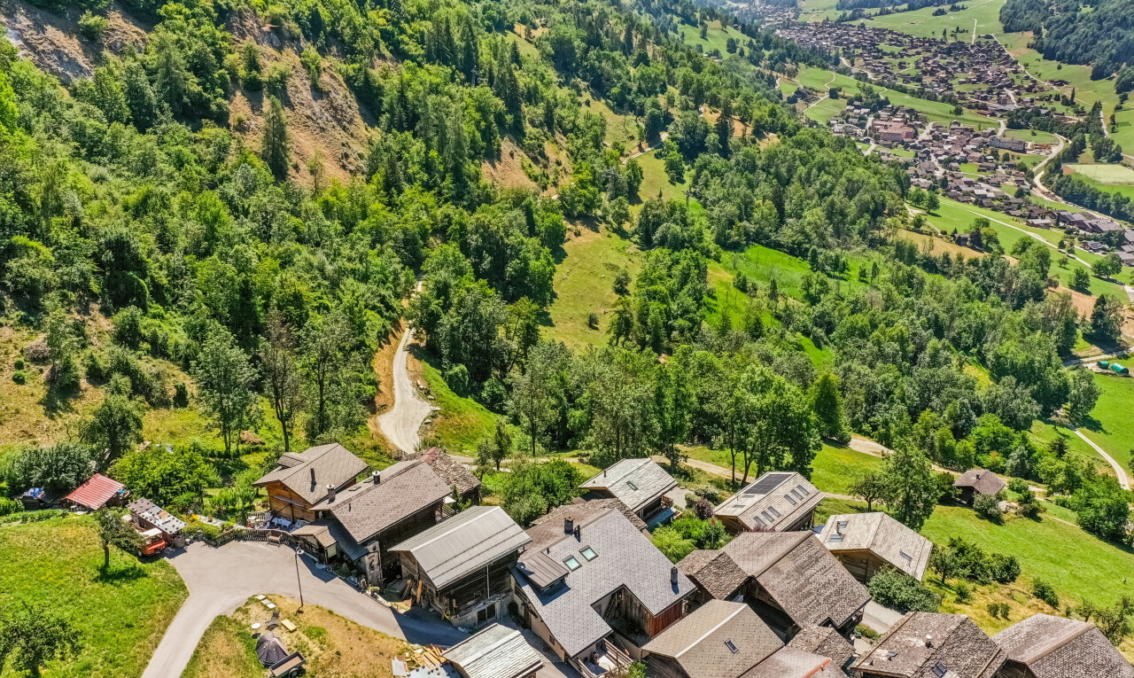 view of mountain background featuring nearby suburban area
