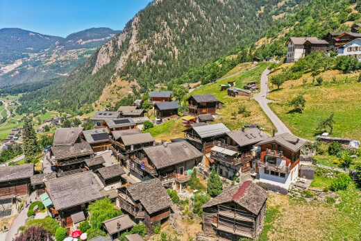 view of mountain background featuring nearby suburban area