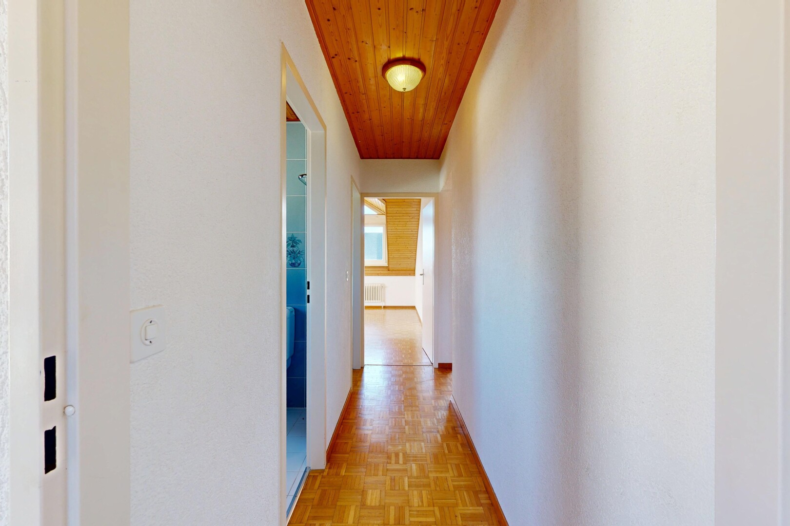 corridor with parquet flooring and wooden ceiling