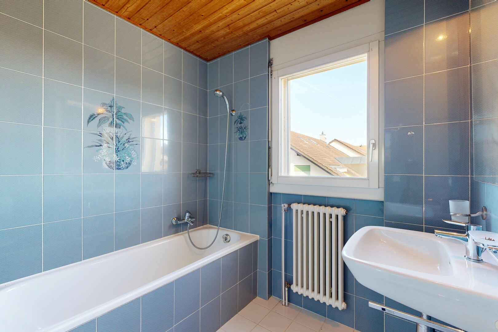 full bath featuring tile walls, radiator heating unit, tiled shower / bath, tile patterned floors, and wooden ceiling