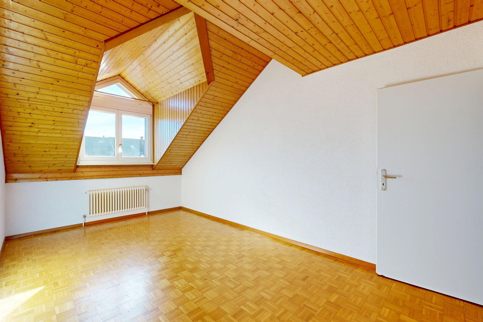 unfurnished room featuring wooden ceiling, parquet floors, and radiator