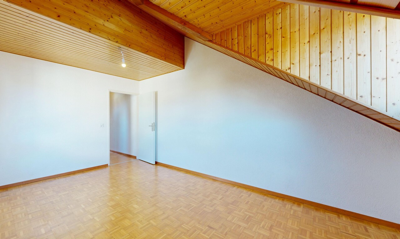 spare room with parquet floors and baseboards
