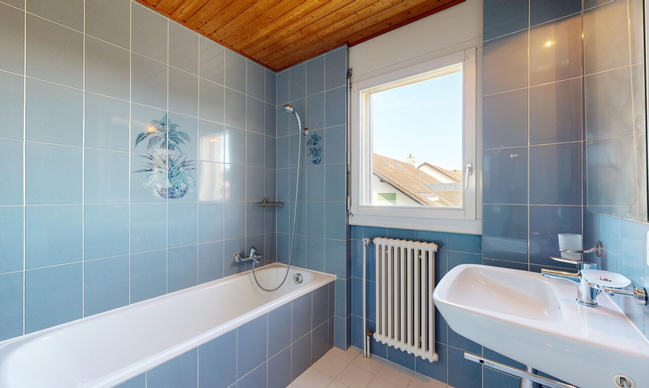 full bath featuring tile walls, radiator heating unit, tiled shower / bath, tile patterned floors, and wooden ceiling