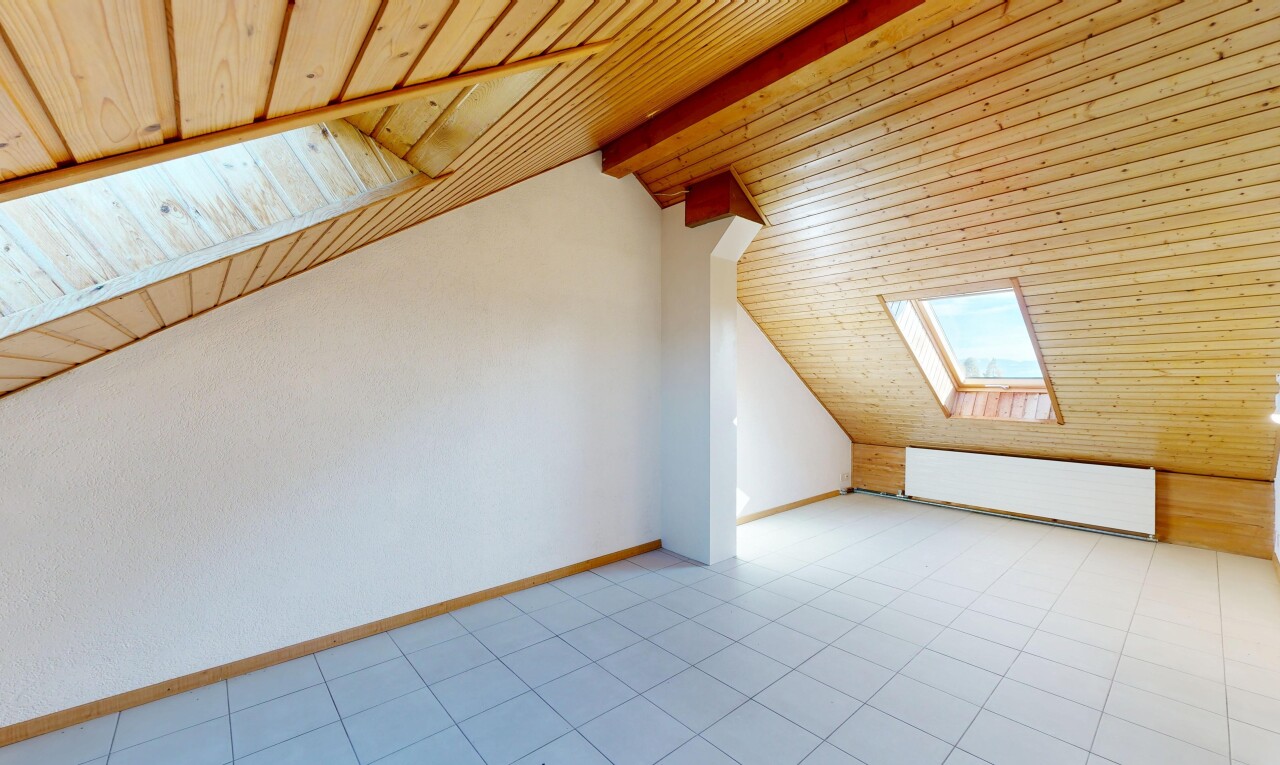 unfurnished room with lofted ceiling with beams, a skylight, and wood ceiling