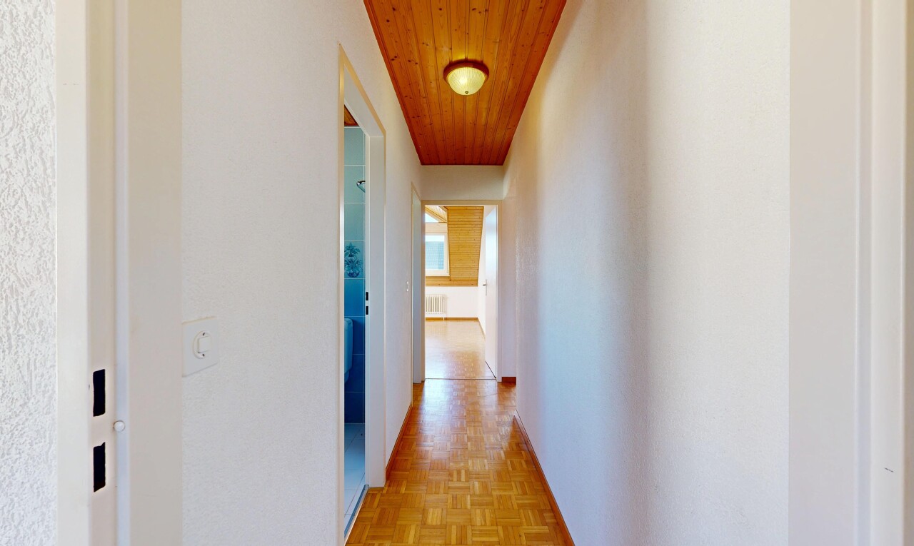 corridor with parquet flooring and wooden ceiling