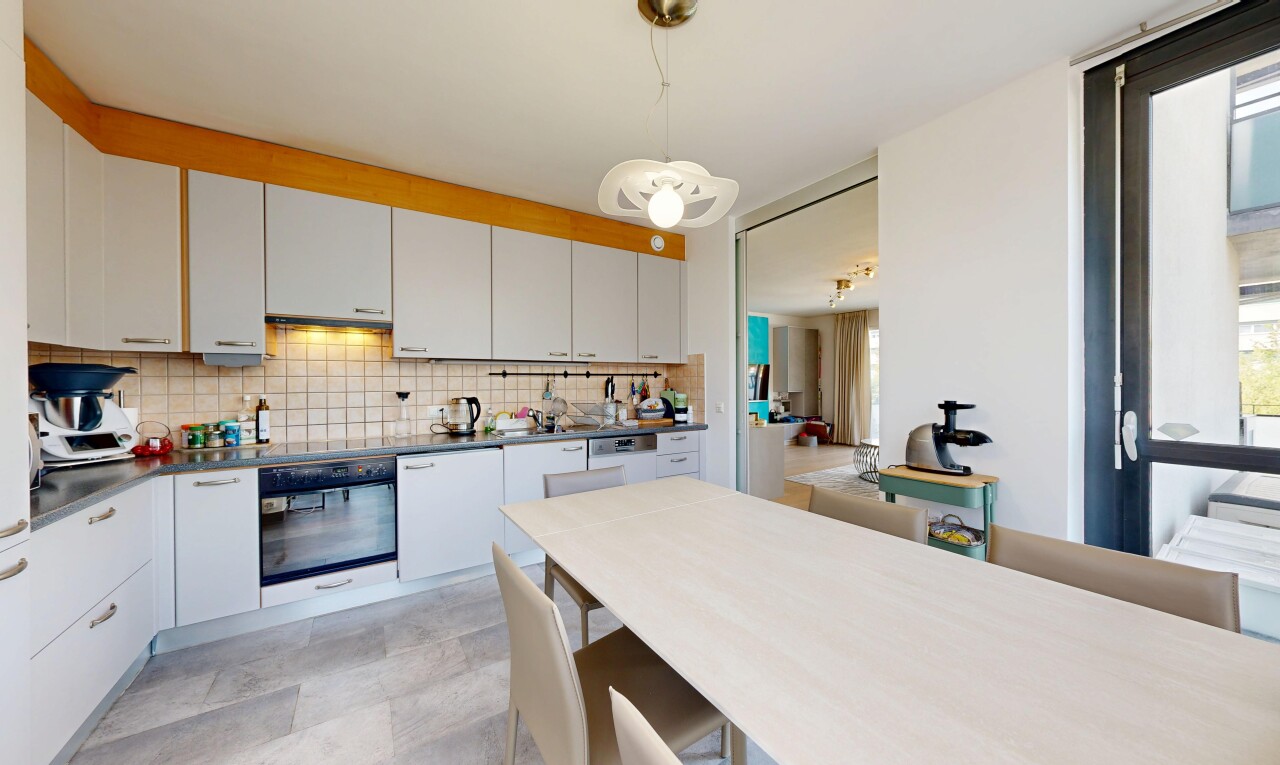 kitchen with wall oven, white cabinets, tasteful backsplash, hanging light fixtures, and dark countertops