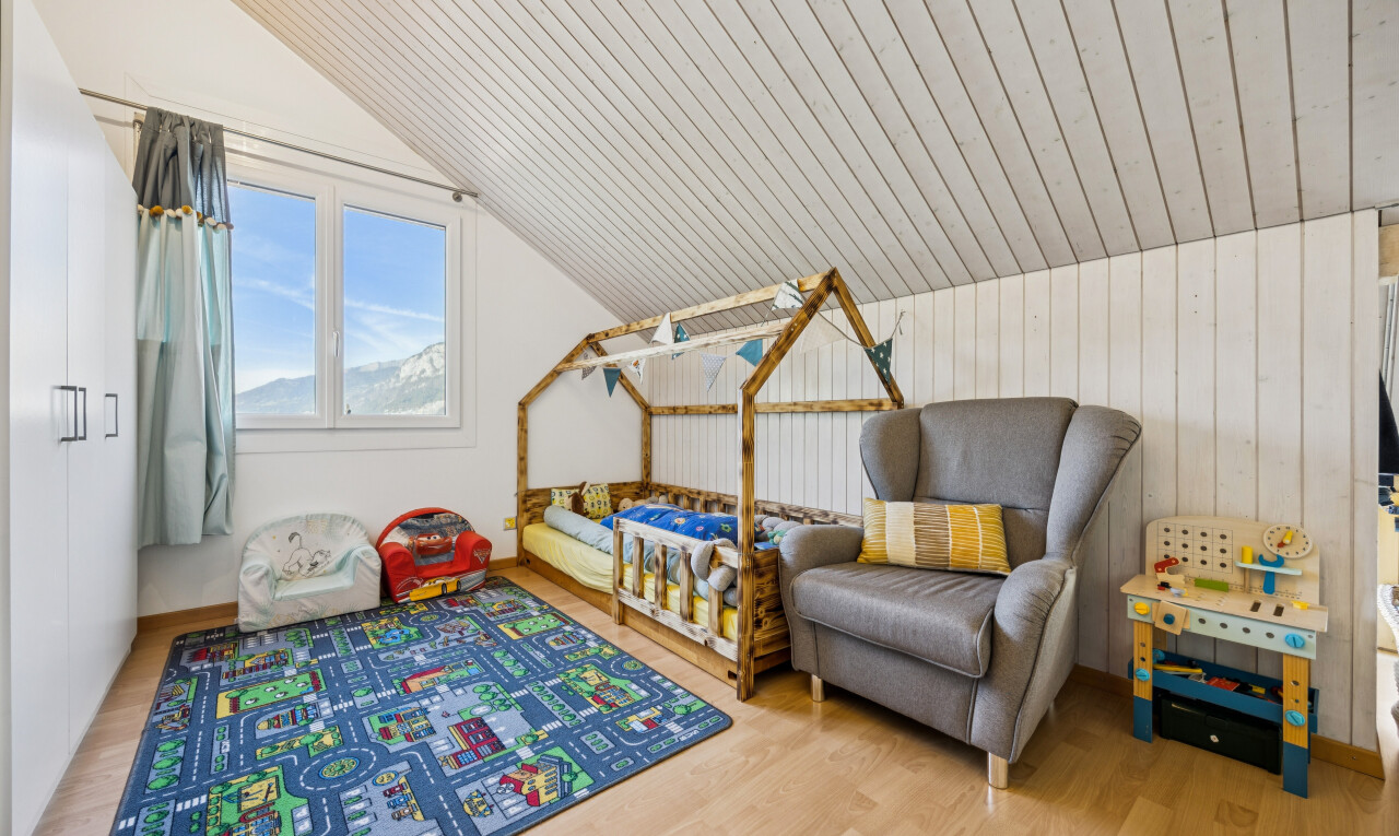 room / bedroom with light wood finished floors, a vaulted wooden ceiling, and wood walls