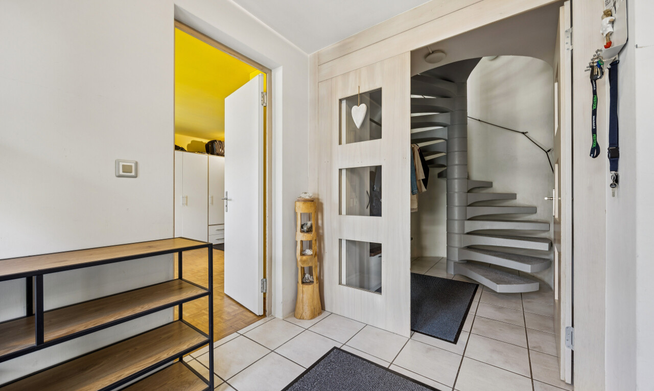 staircase with light tile patterned floors