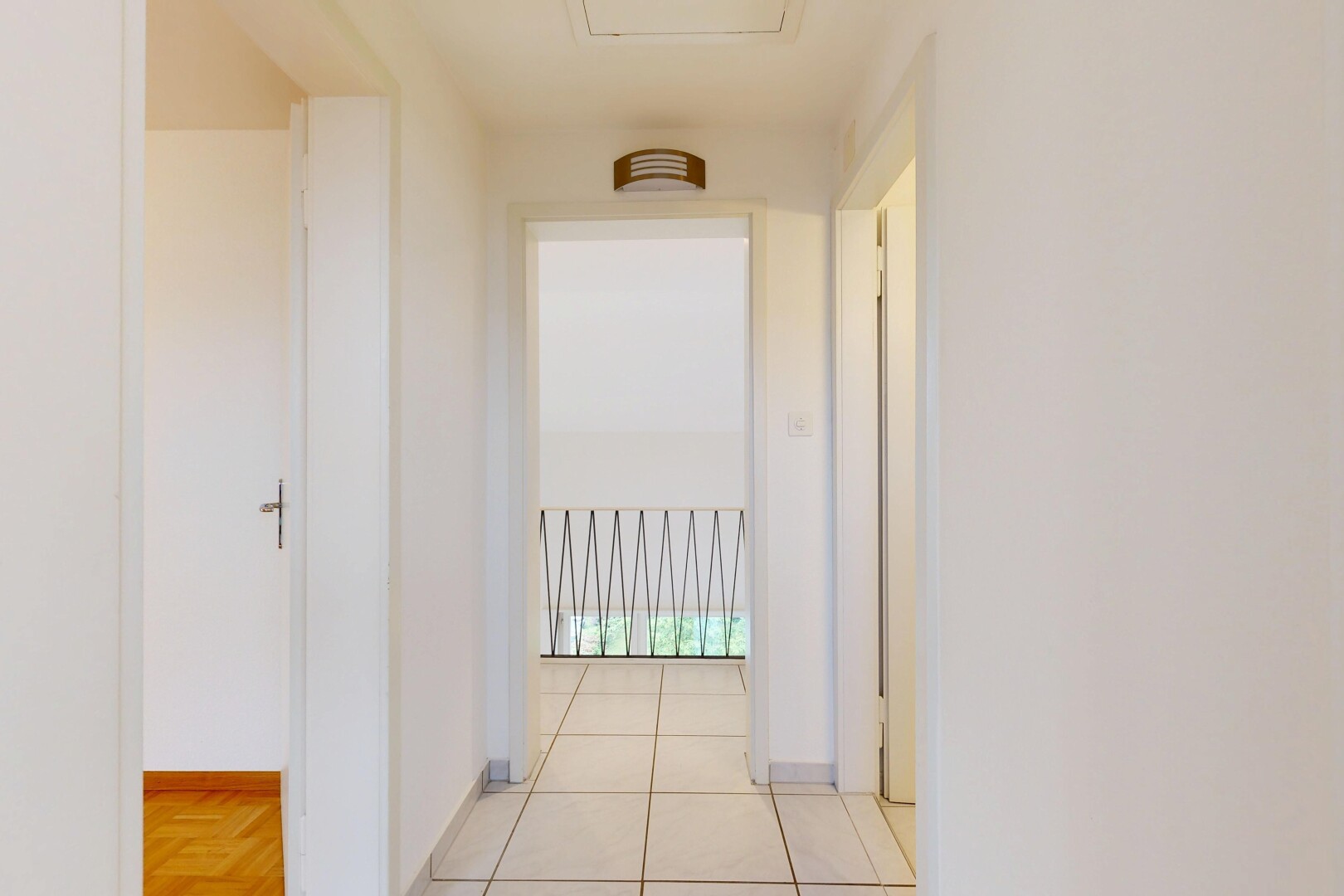 hallway featuring baseboards