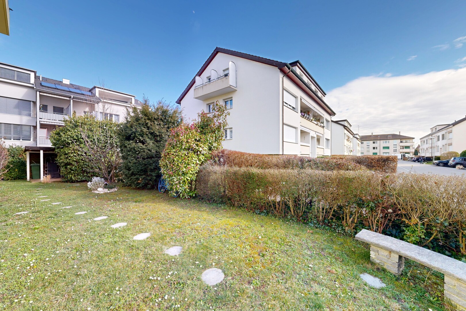 view of property with a lawn and stucco siding