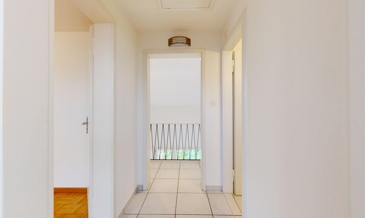 hallway featuring baseboards