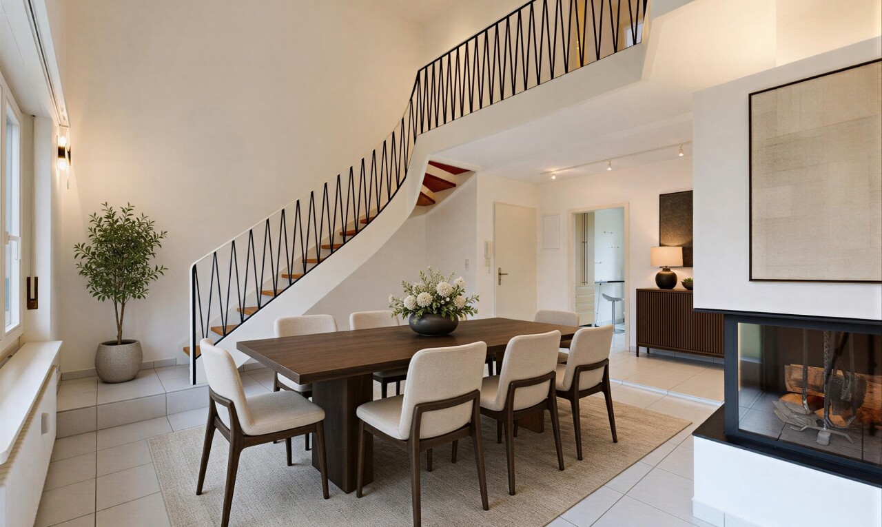 unfurnished living room with a high ceiling, rail lighting, and light tile patterned floors