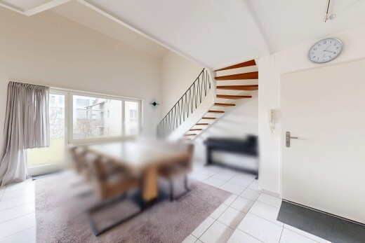 dining area with light tile patterned flooring and lofted ceiling