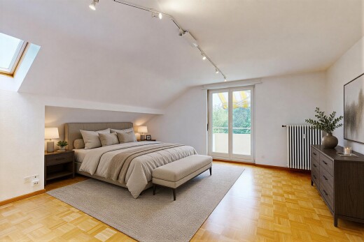 empty room featuring radiator, rail lighting, parquet flooring, a skylight, and lofted ceiling