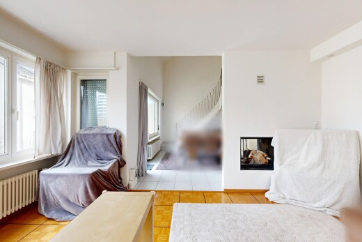 living area with radiator heating unit and plenty of natural light