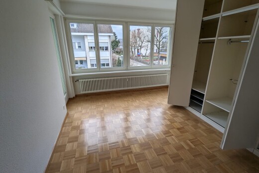 empty room featuring radiator heating unit and parquet flooring