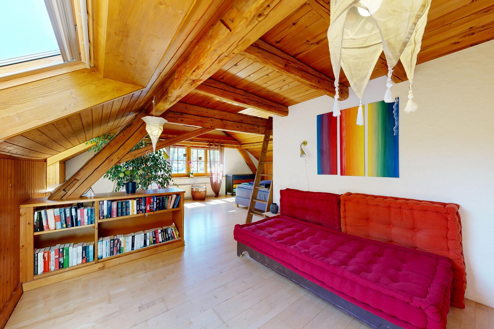 living room with a wood ceiling with exposed beams and light wood-style floors