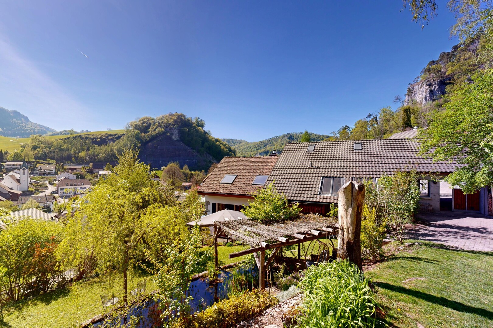 view of home featuring a mountain view and a tile roof