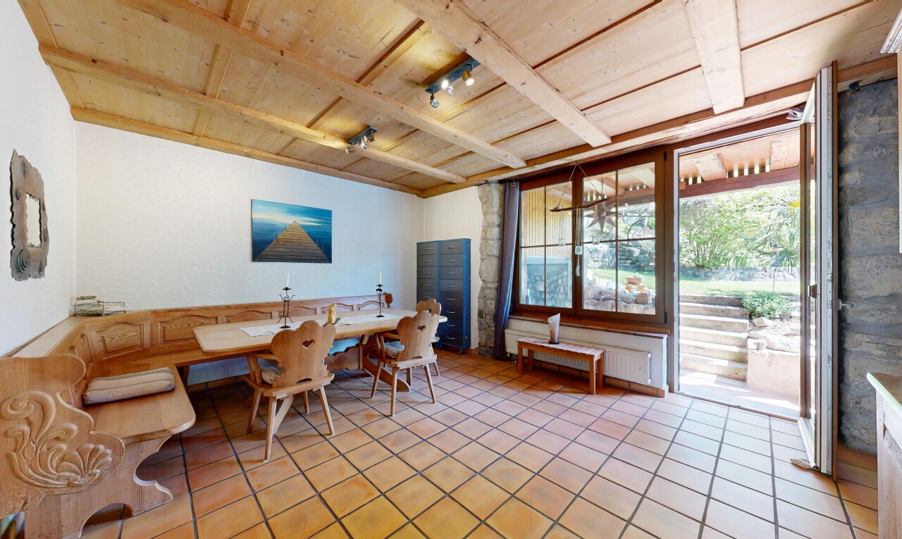 dining room featuring a wooden ceiling with exposed beams, radiator, and light tile patterned flooring
