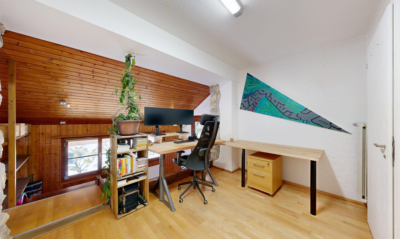 home office featuring lofted ceiling and light wood-style floors
