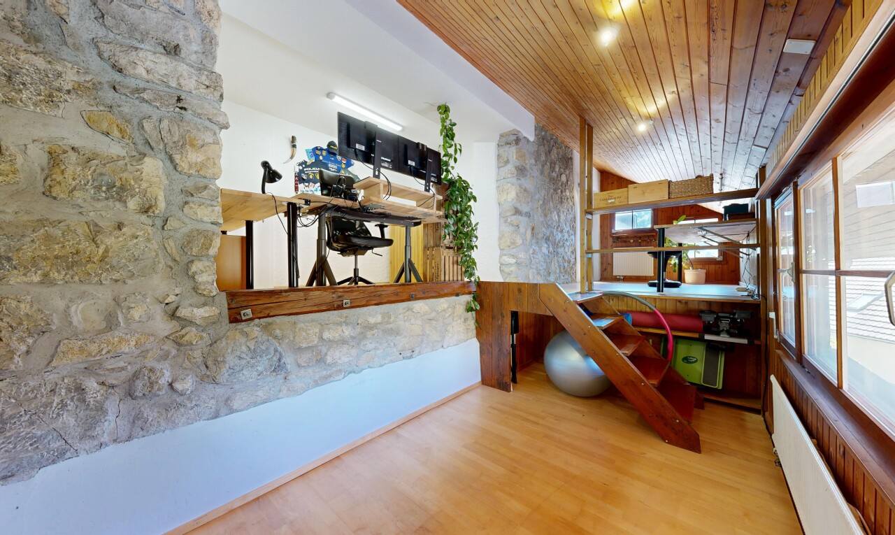staircase with wood ceiling and wood finished floors
