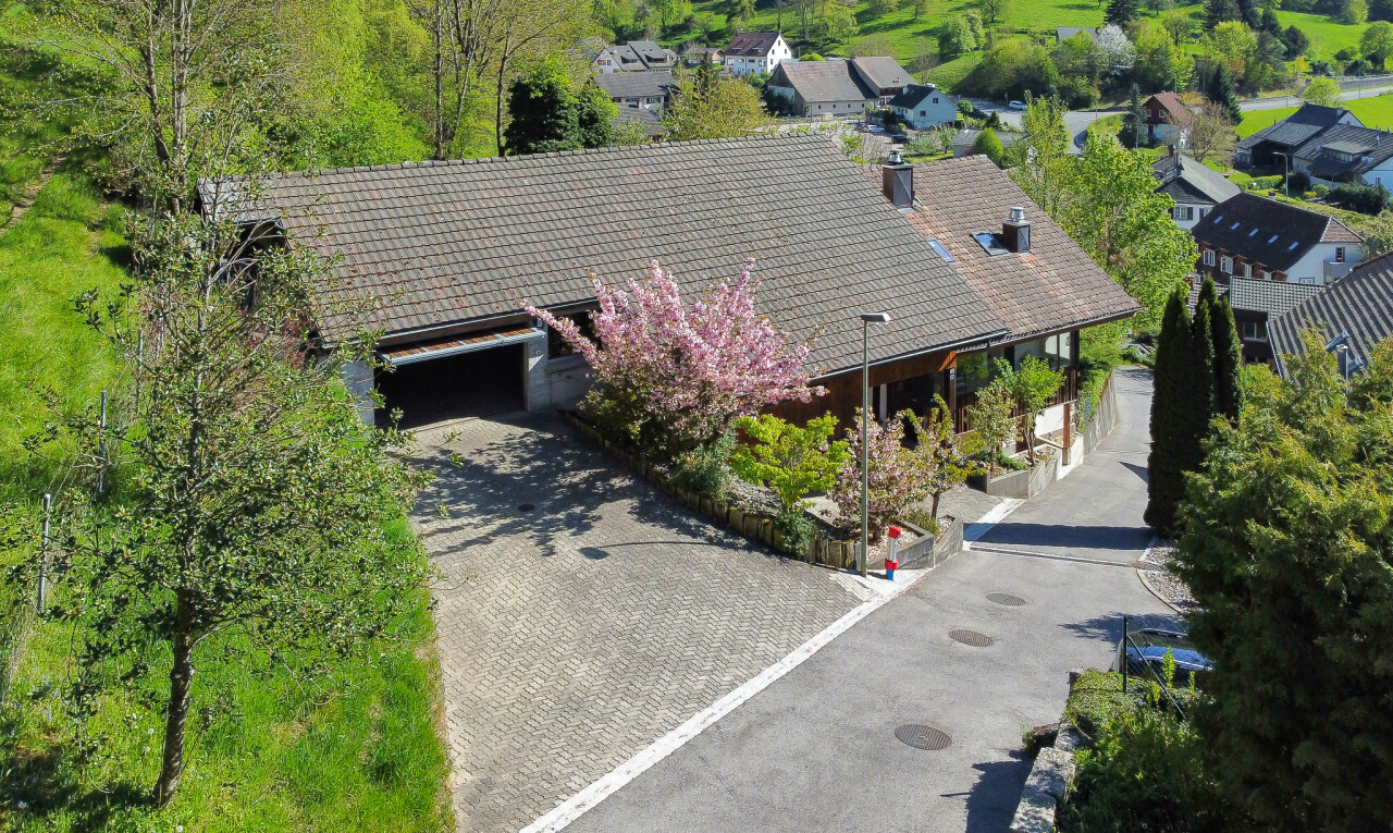 view of property featuring decorative driveway