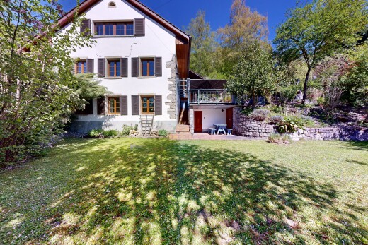 außenansicht mit rasen, property visible, day time, stuckverkleidung, und treppen