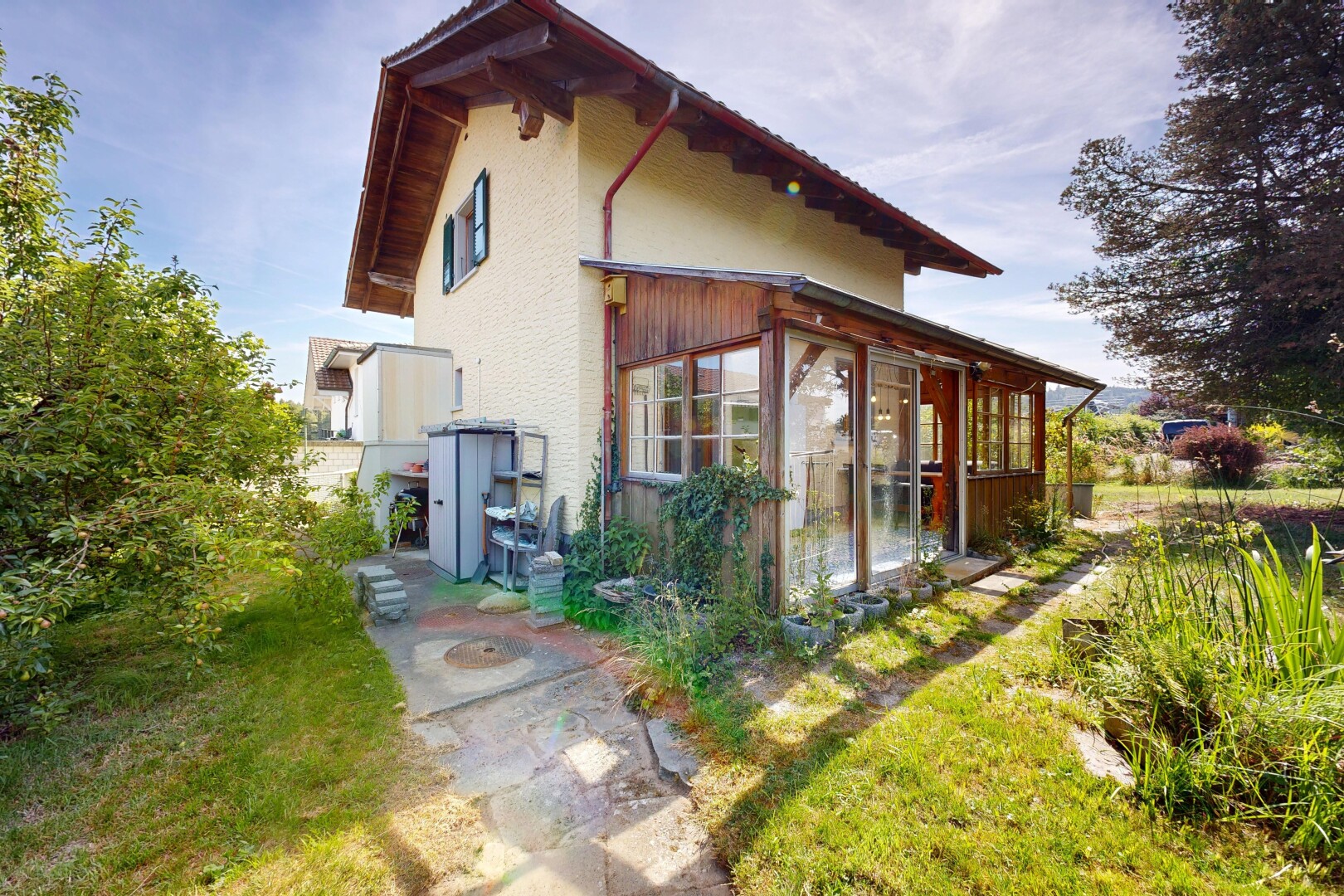view of home featuring a sunroom