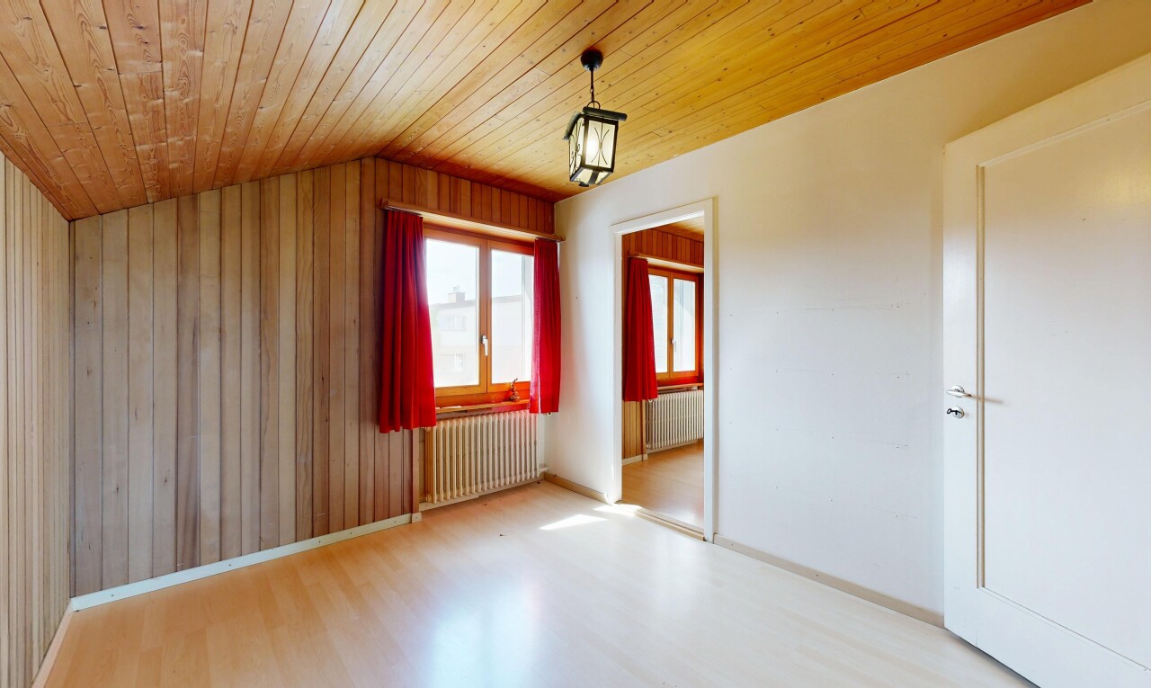 spare room with a vaulted wooden ceiling, radiator heating unit, light wood-type flooring, and wood walls