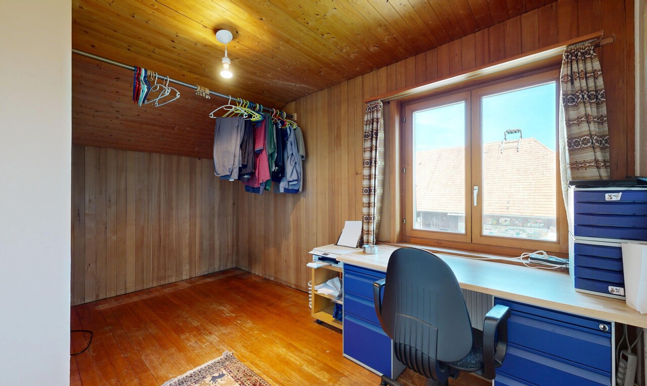 home office with wood walls, light wood-type flooring, and wooden ceiling